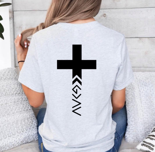 Ash white crewneck t-shirt with a cross on the back that has the symbol “God is greater than the highs and lows” as the bottom part of the cross.  