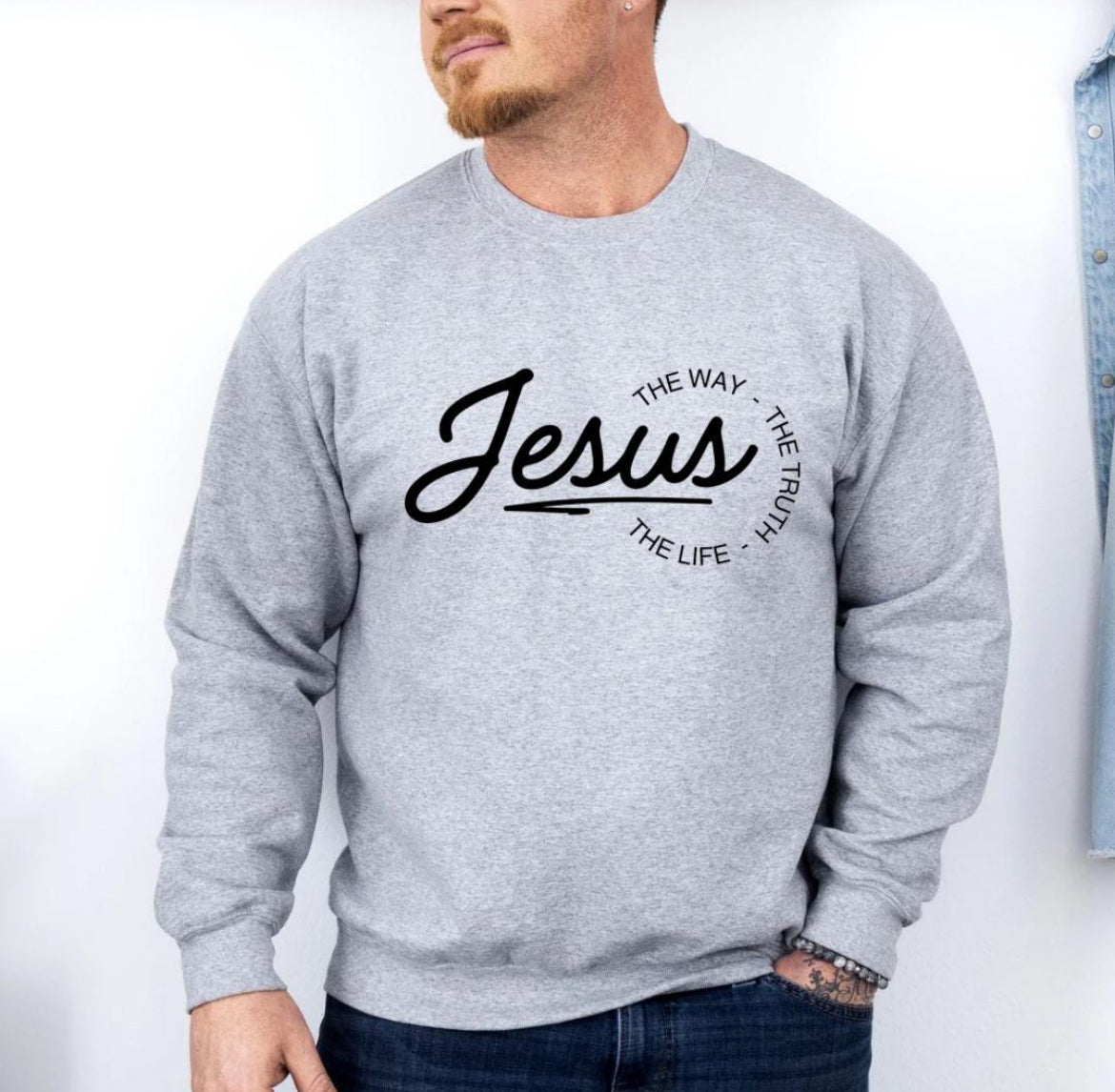 Light grey crewneck sweatshirt that says, "Jesus, the way, the truth, the life." 