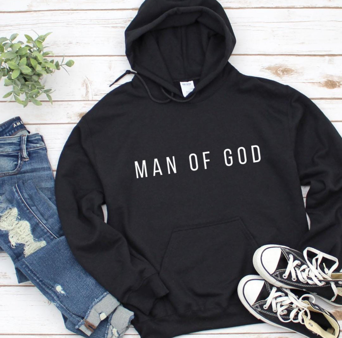 Black hoodie that says, "Man of God" in bold letters across the chest.