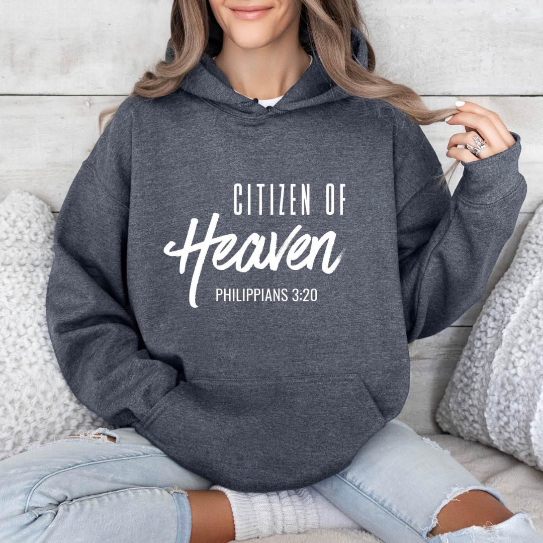 Dark heather grey hoodie sweatshirt that says, "Citizen of Heaven". Underneath in smaller writing it says, "Philippians 3 20."