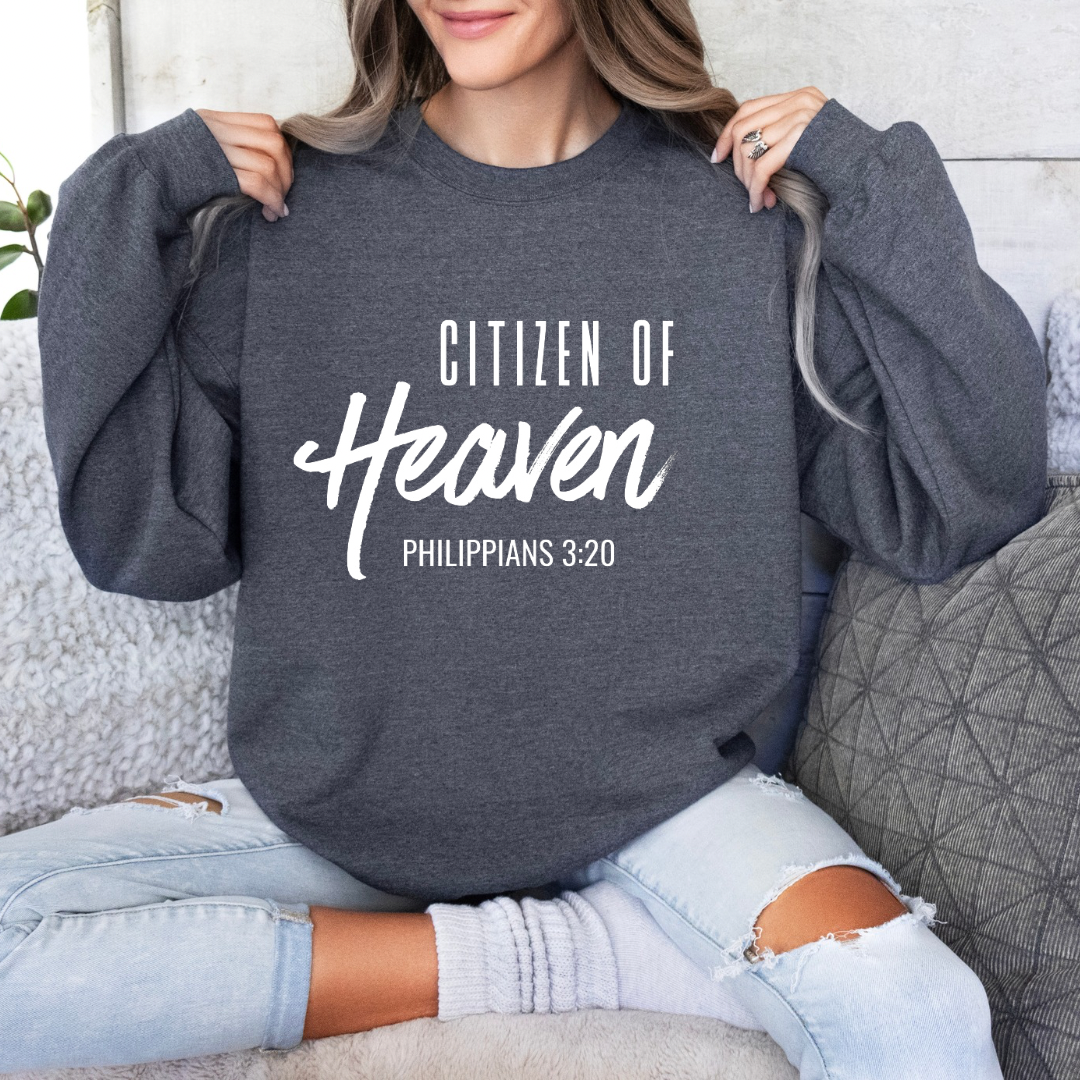 Dark grey heather crewneck sweatshirt that says, "Citizen of Heaven". Underneath in smaller writing it says, "Philippians 3 20."