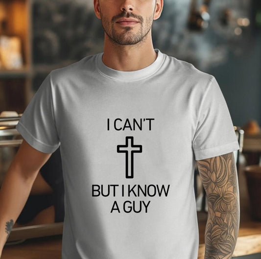 Grey crewneck t-shirt that says, “I can’t but I know a guy” with a cross in the middle.