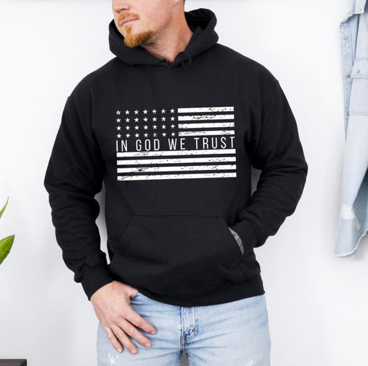 Black hoodie with a distressed American flag that says, "In God we trust" across the middle of the flag.