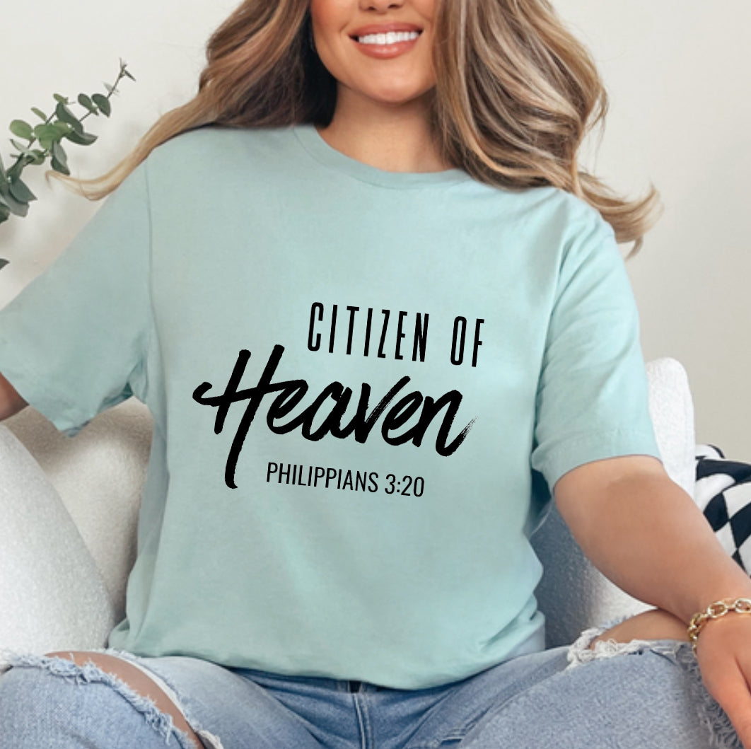 Dusty green crewneck t-shirt that says, "Citizen of Heaven". Underneath in smaller writing it says, "Philippians 3 20."