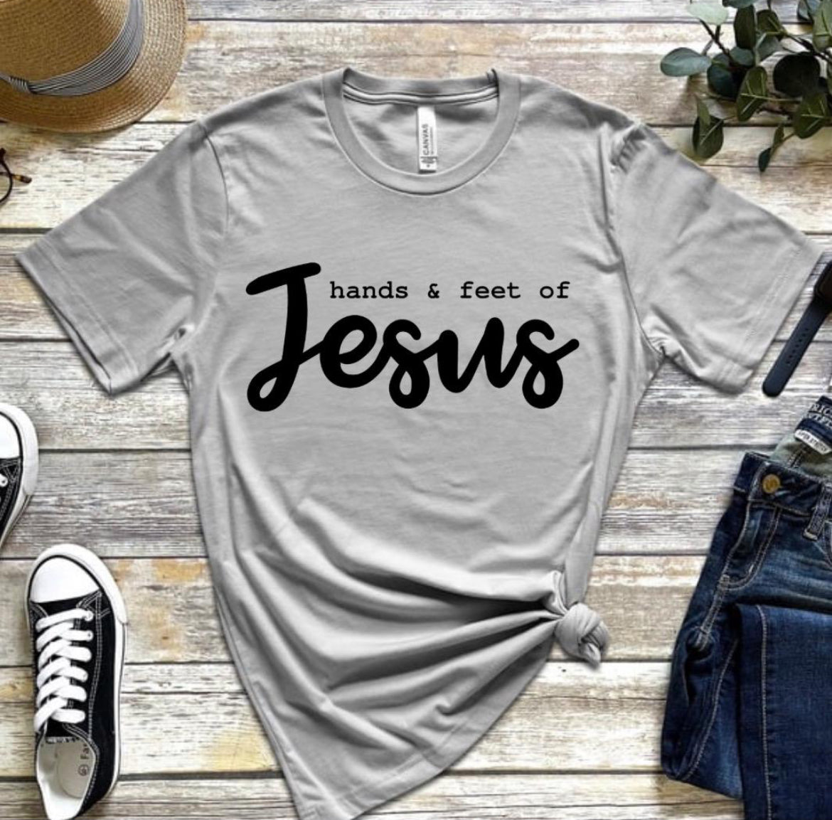 Grey crewneck t-shirt that says, “hands and feet of Jesus.”