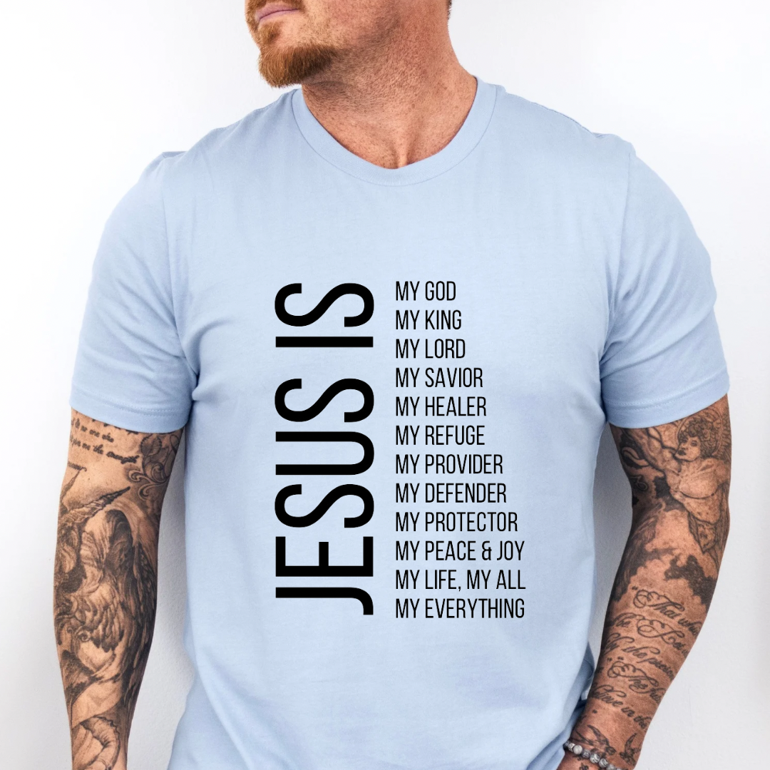 Baby blue crewneck t-shirt that says, “Jesus Is my, God, king, Lord, savior, healer, refuge, provider, defender, protection, peace. joy, life, all, everything.”