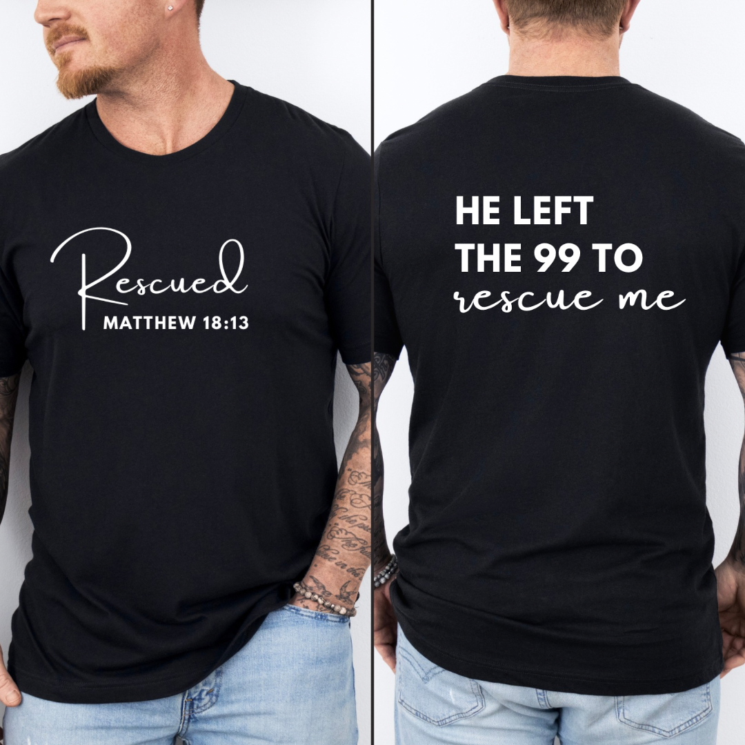 crewneck T-Shirt that says, "He left the 99 to rescue me". On the front it says, "Matthew 18:13 rescued" with a tan sheep.