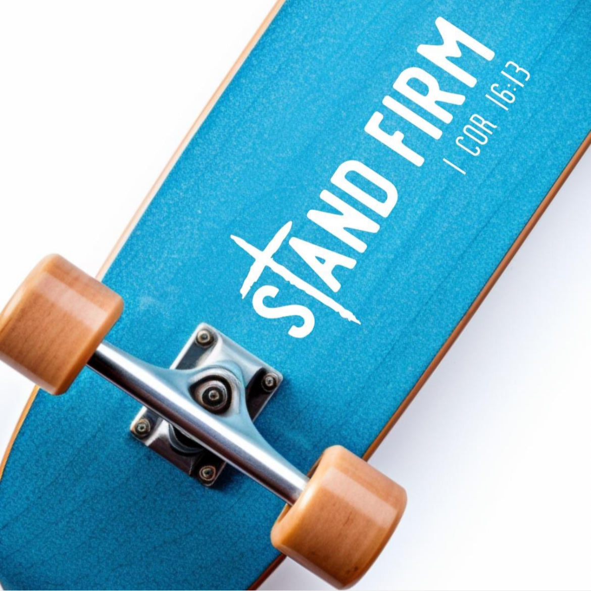 Skateboard sticker decal  that says, “Stand firm” in large letters. The “T” in “stand” is a cross. Underneath in smaller letters it says, “1 Corinthians 16 13.”