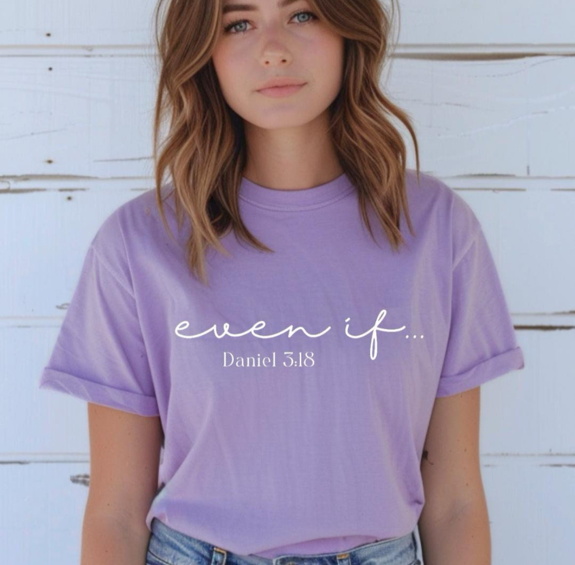 Lavender crewneck t-shirt that says, “even if…” in cursive letters. Underneath in smaller letters it says, “Daniel 3 18.”