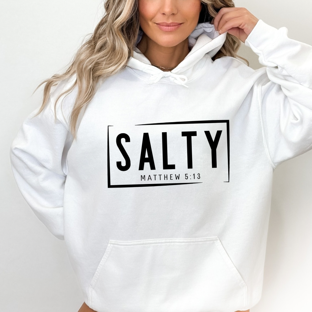 White hoodie sweatshirt that says, “SALTY” in large capital letters. Underneath in smaller letters it says, “Matthew 5:13.”