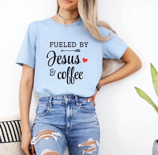 Baby blue crewneck t-shirt that says, “fueled by Jesus and coffee.”