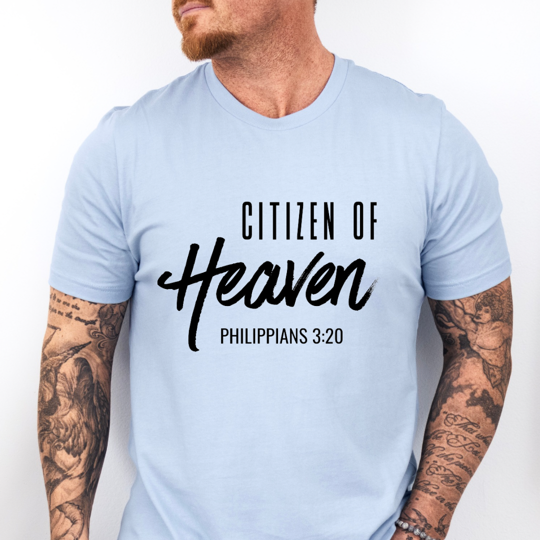  Baby blue crewneck t-shirt that says, "Citizen of Heaven". Underneath in smaller writing it says, "Philippians 3 20."