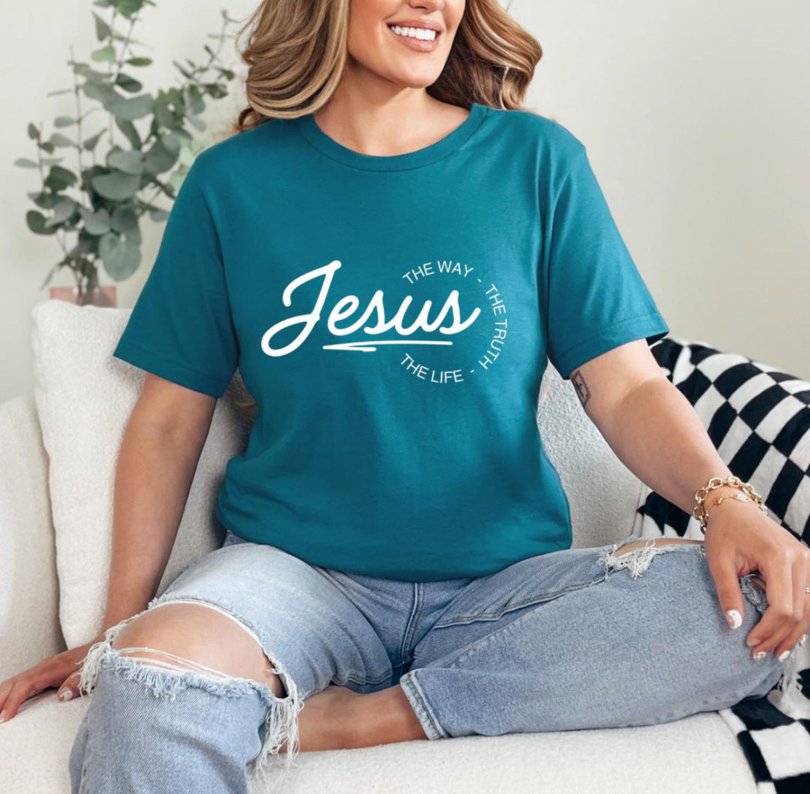 Deep teal crewneck t-shirt that says, “Jesus the way the truth the life.”