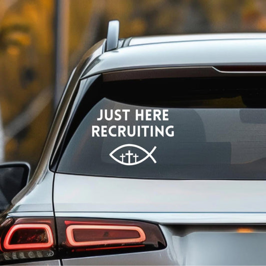 Car decal that says, “Just here recruiting” with the ichthus fish symbol with three crosses in the middle.