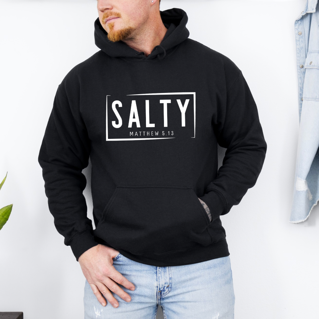 Black hoodie sweatshirt that says, “SALTY” in large capital letters. Underneath in smaller letters it says, “Matthew 5:13.”