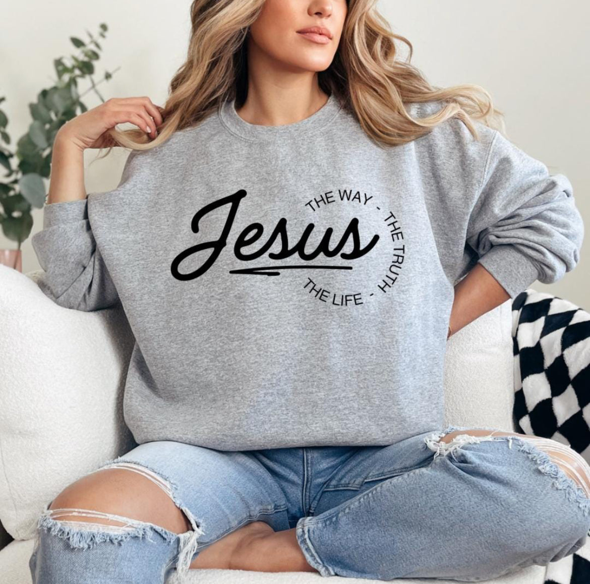 Light gray crewneck sweatshirt that says, "Jesus, the way, the truth, the life." 