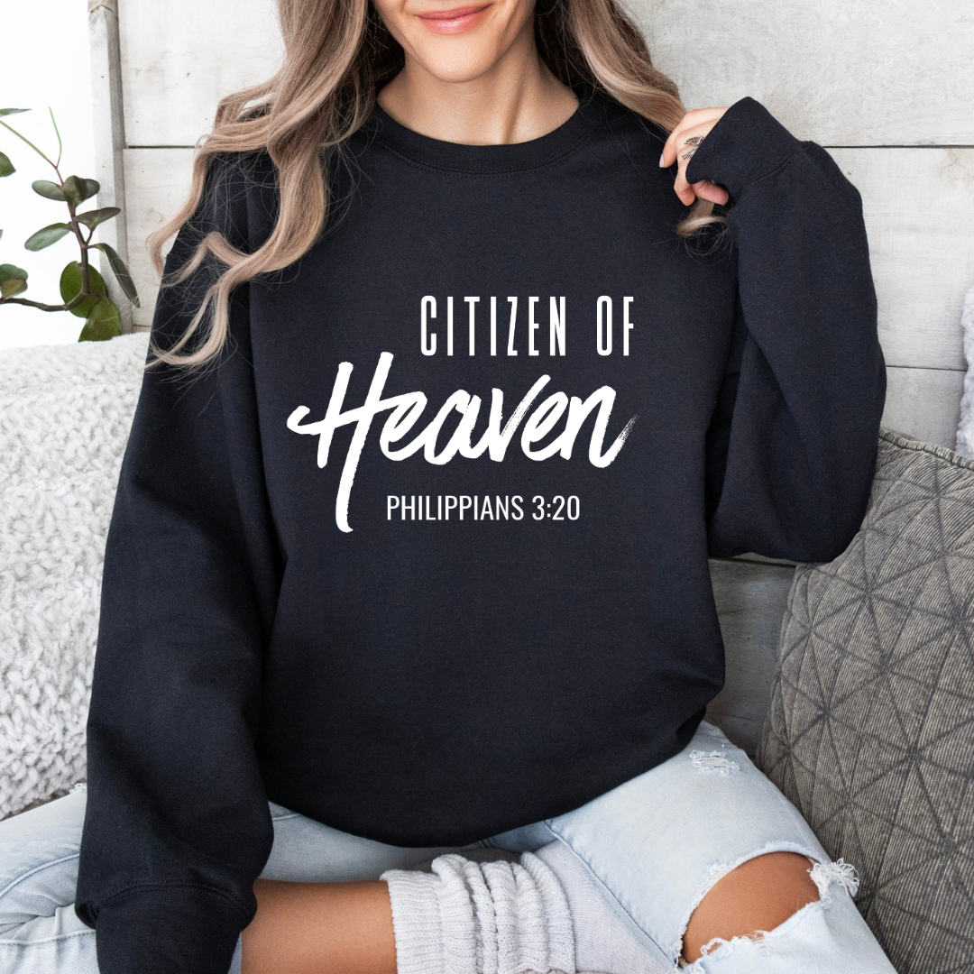 Black crewneck sweatshirt that says, "Citizen of Heaven". Underneath in smaller writing it says, "Philippians 3 20."