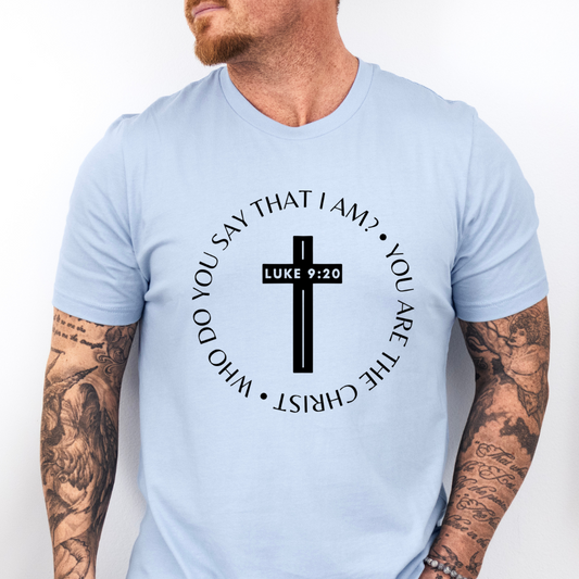 Baby blue crewneck t-shirt that says, “who do you say that I am? you are the Christ?” With a cross that says, “Luke 9:29” through the middle. 