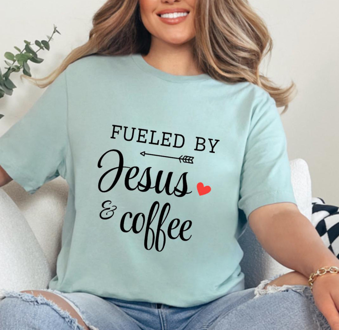 Dusty green crewneck t-shirt that says, “fueled by Jesus and coffee.”