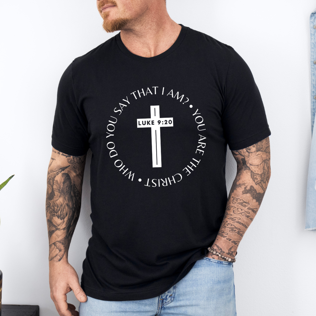 Black crewneck t-shirt that says, “who do you say that I am? you are the Christ?” With a cross that says, “Luke 9:29” through the middle. 