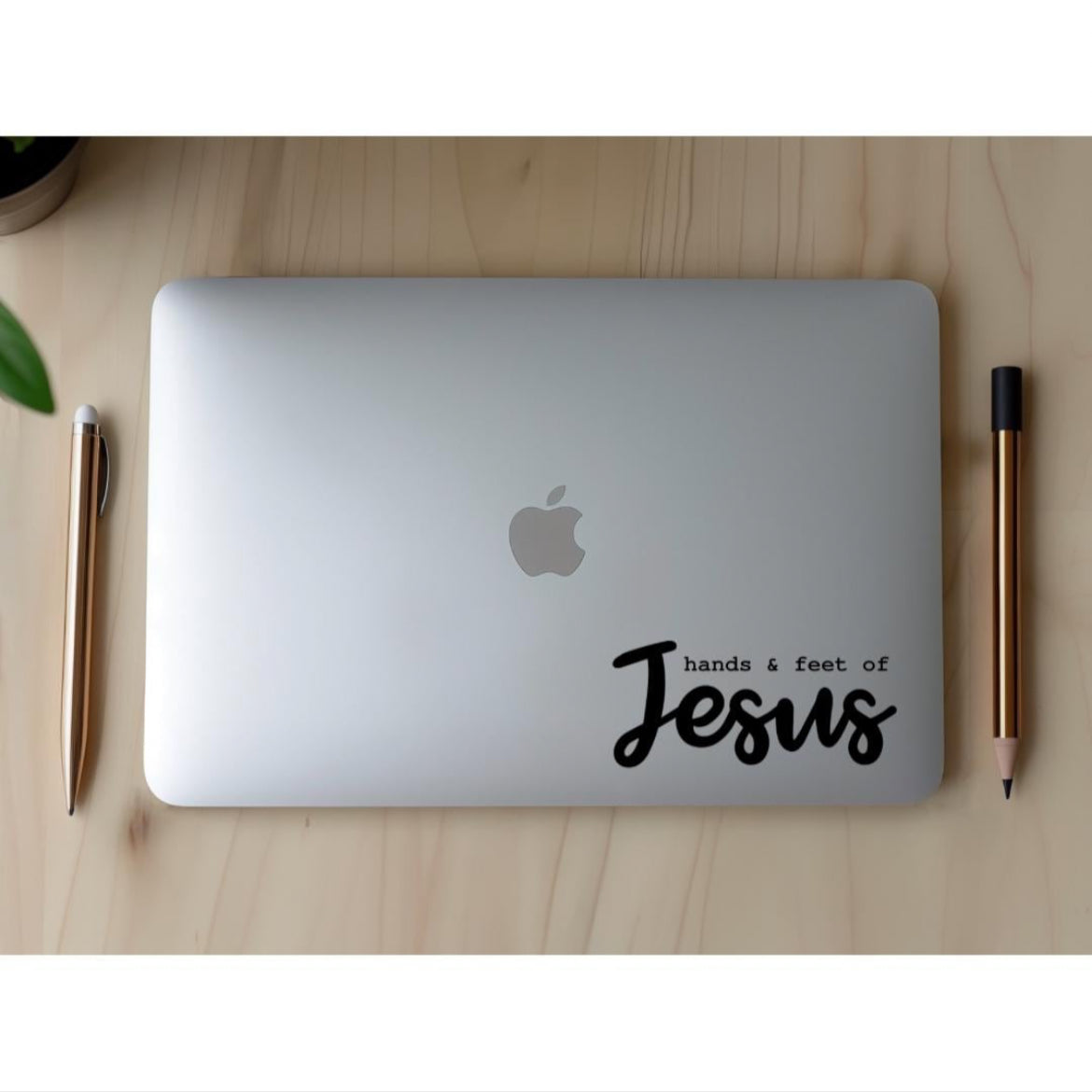 Laptop sticker decal that says, “hands and feet of Jesus”. The word “Jesus” is in large cursive letters. 