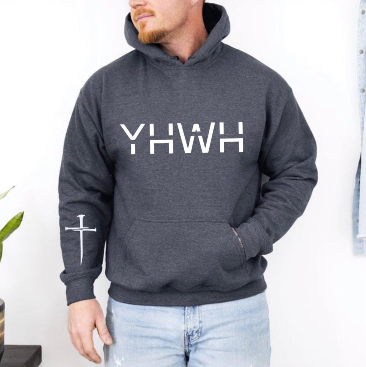 Grey hoodie that says, "YHWH" with a cross on the sleeve. 