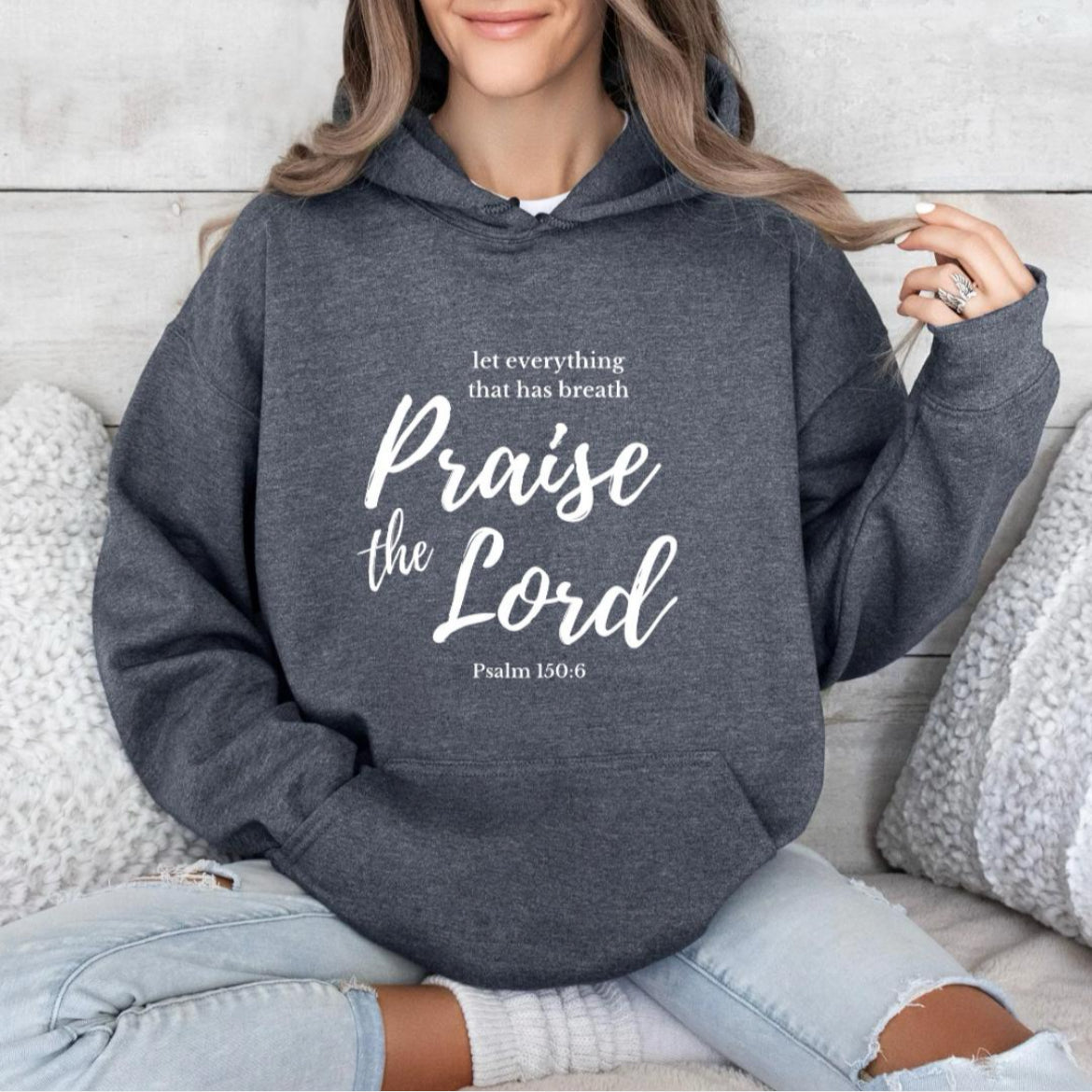 Dark gray hoodie that says, "Let everything that has breath Praise the Lord." Underneath it says, "Psalm 150 verse 6."