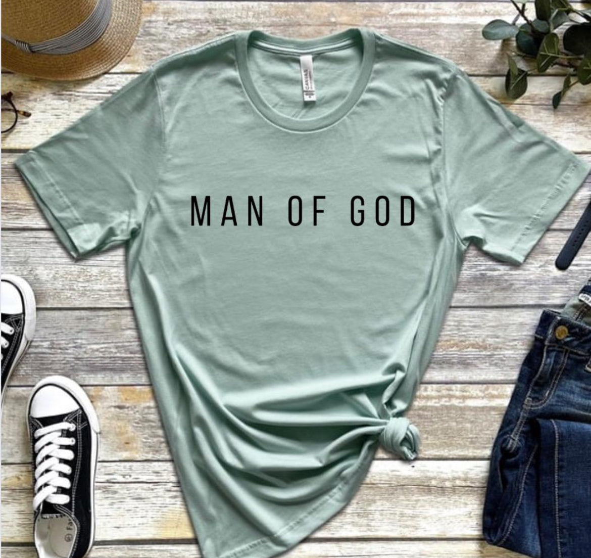 Dusty green crewneck t-shirt that says, “man of God” in large bold letters.