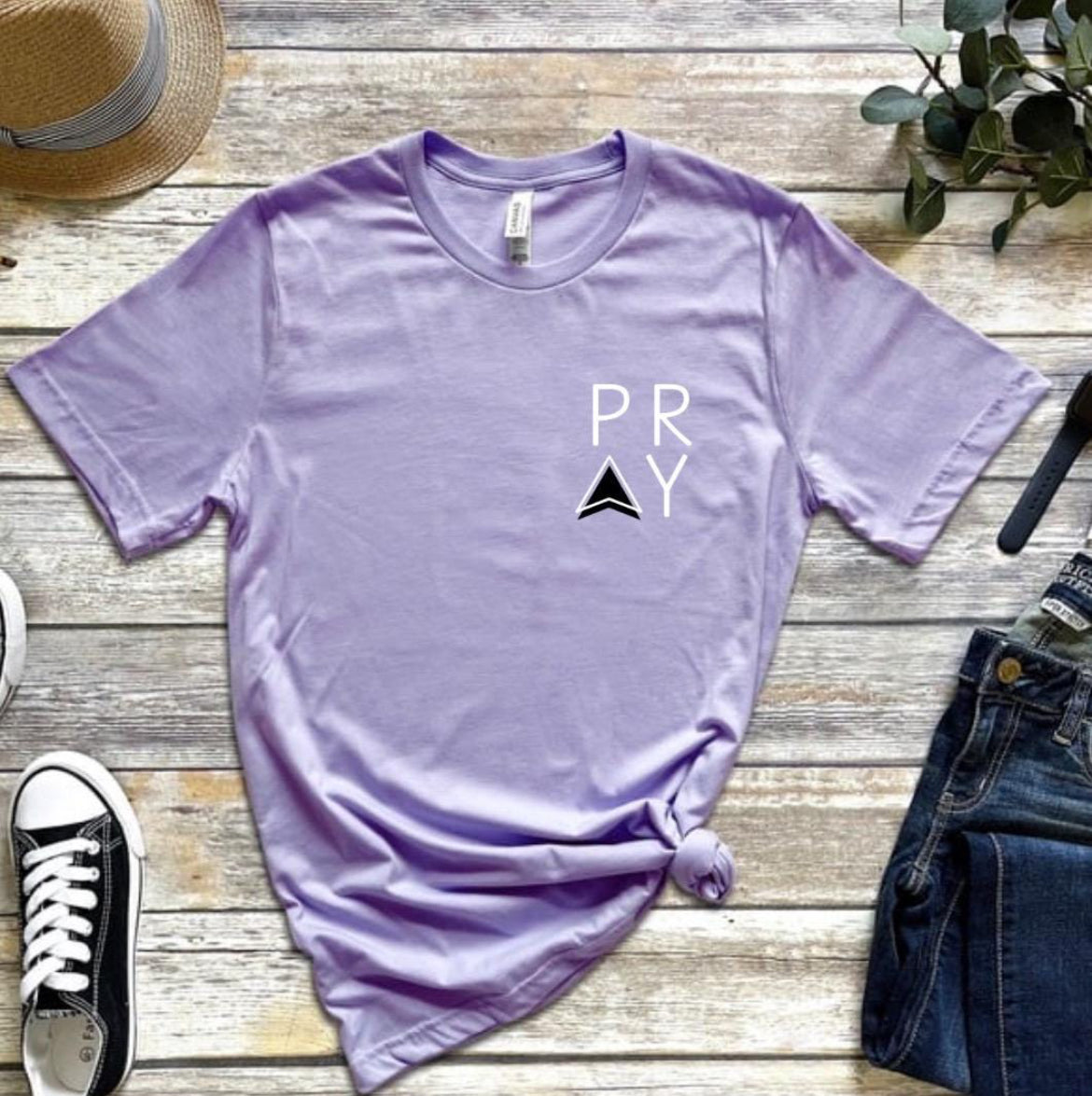 Lavender Crewneck t-shirt that says,“PRAY” up in the left-hand corner of the shirt. 