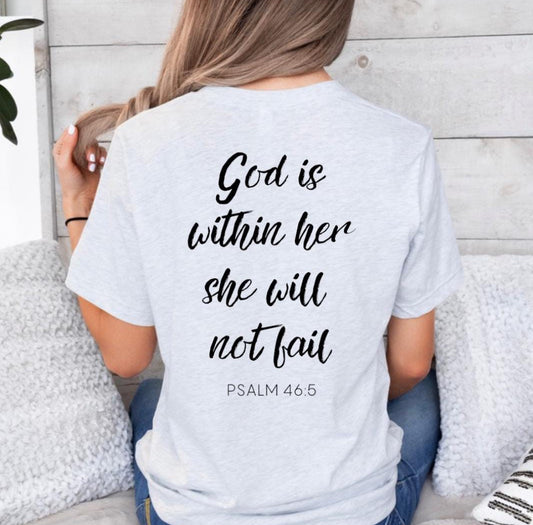 Ash white crewneck t-shirt back that says, “God is within her she will not fail.” Underneath in smaller letters it says, “Psalm 46 5.” 