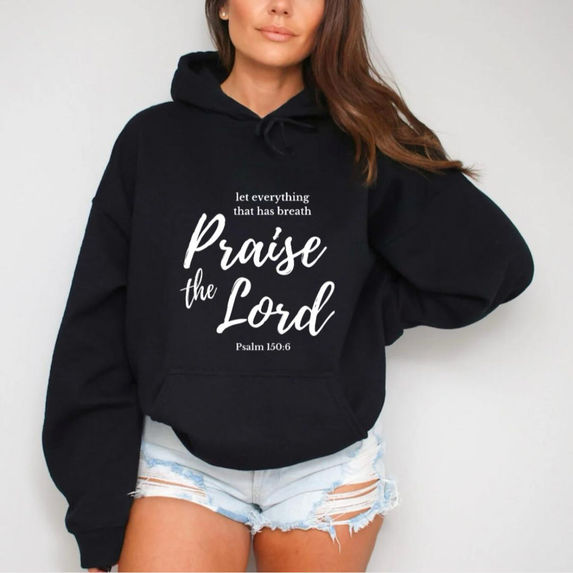 Black hoodie that says, "Let everything that has breath Praise the Lord." Underneath it says, "Psalm 150 verse 6."