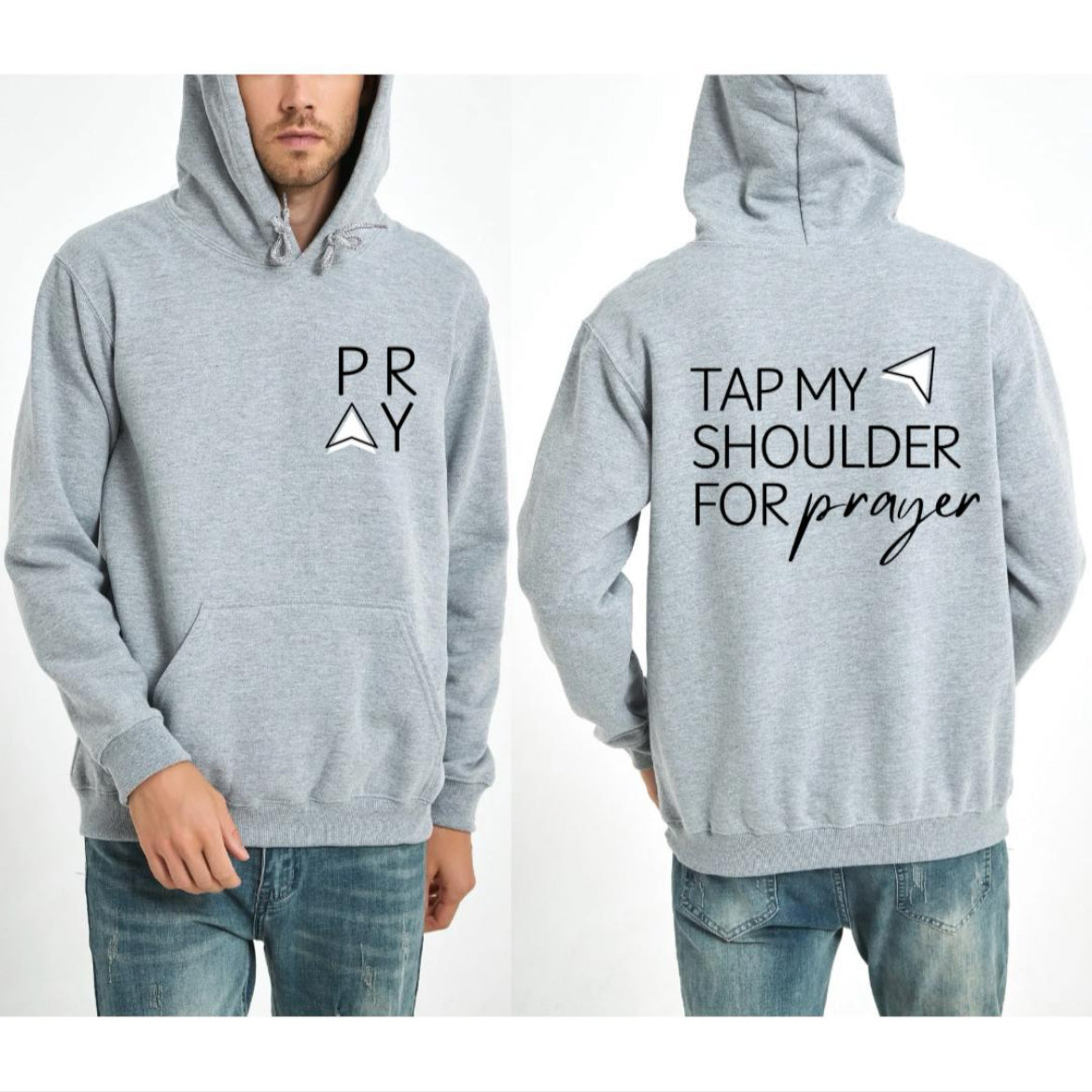 Light gray hoodie that says, "PRAY" where the A is an arrow in the front left-hand corner of the hoodie. Back has an aesthetic arrow pointing towards the shoulder that says, "Tap my shoulder for prayer."