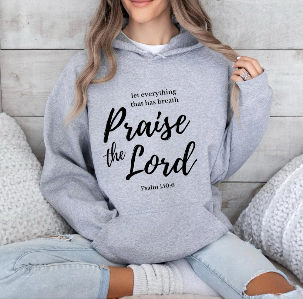 Light gray hoodie that says, "Let everything that has breath Praise the Lord." Underneath it says, "Psalm 150 verse 6."