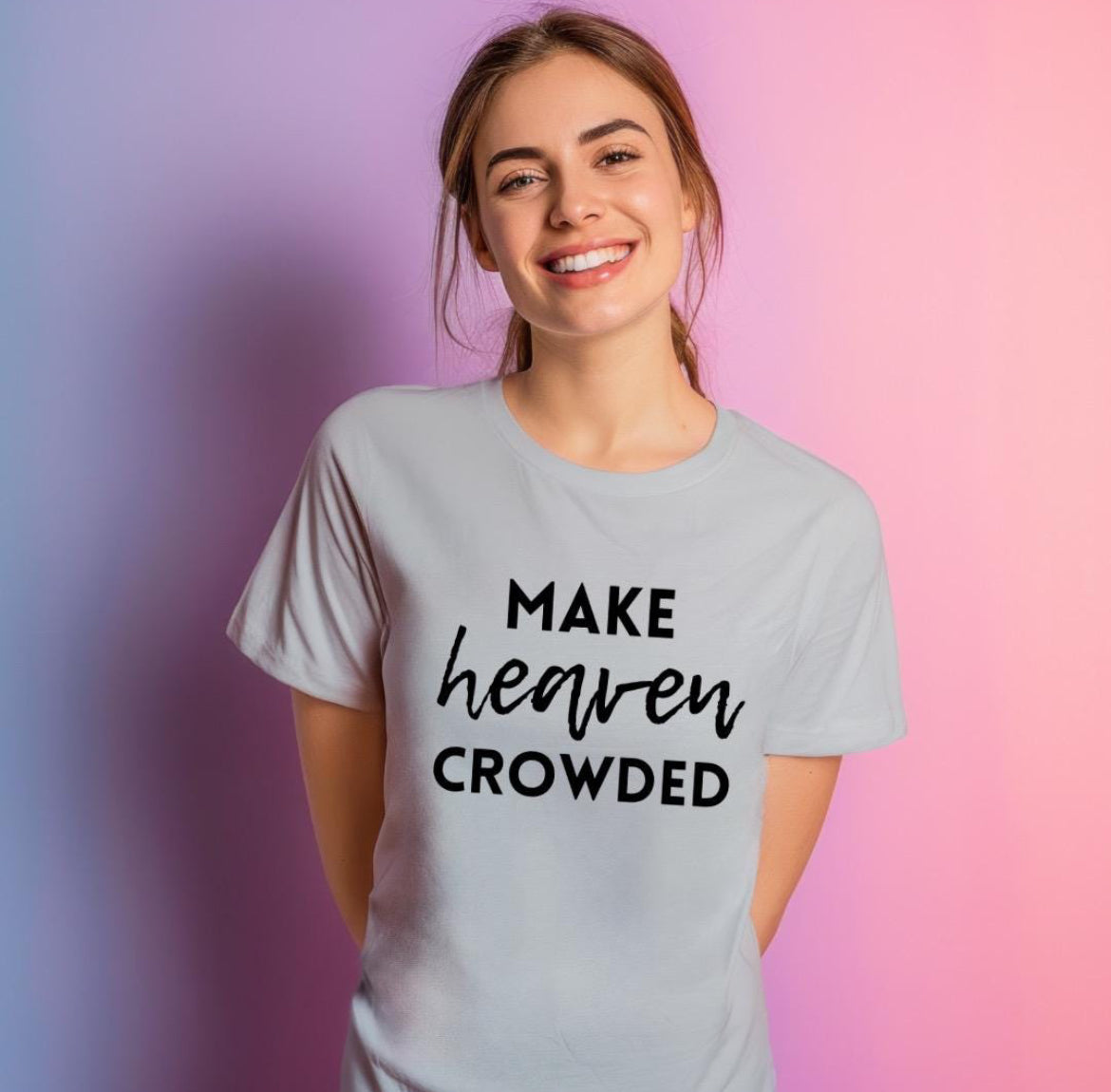 Grey crewneck t-shirt that says, “make heaven crowded.”