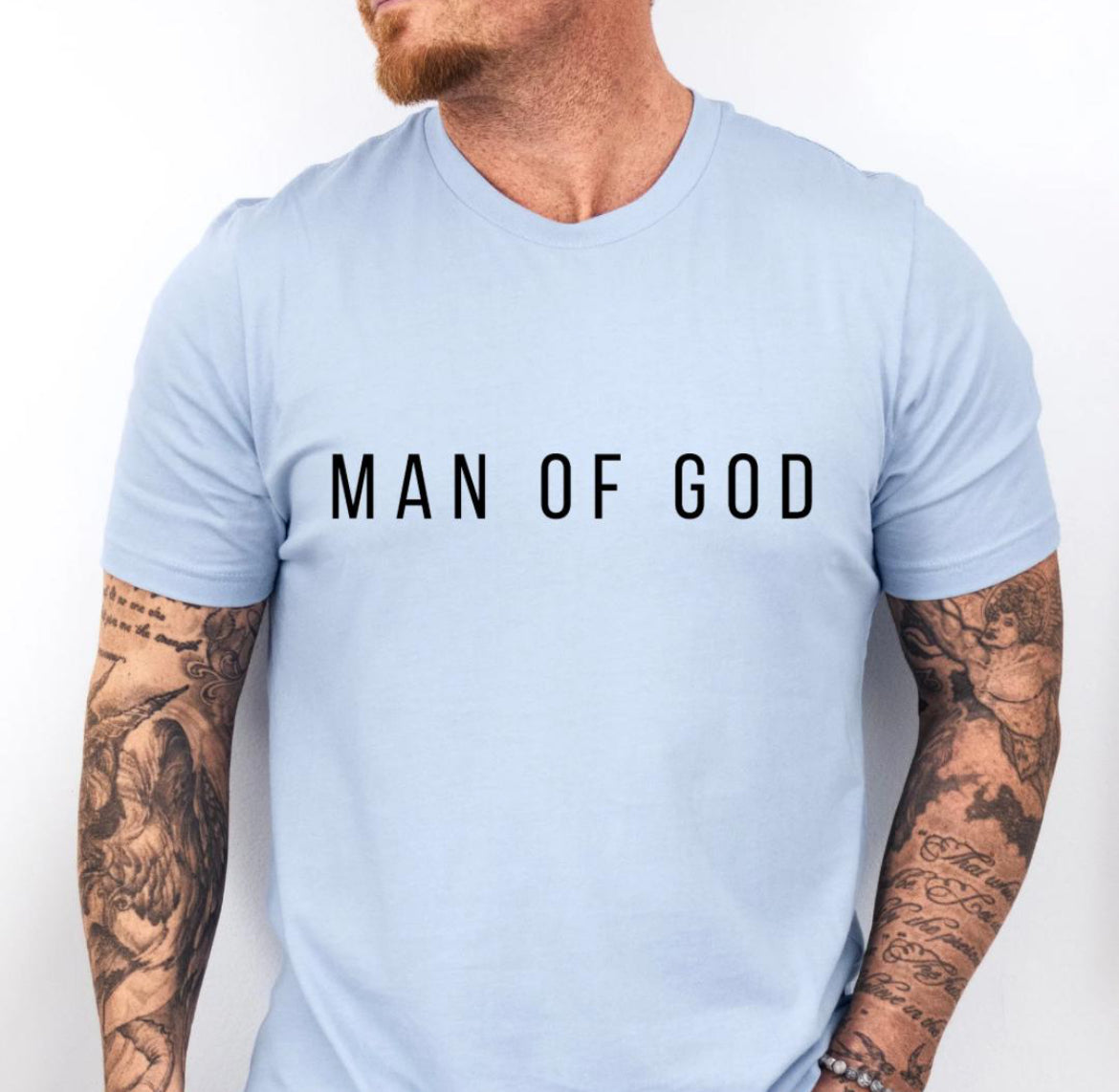 Baby blue crewneck t-shirt that says, “man of God” in large bold letters.