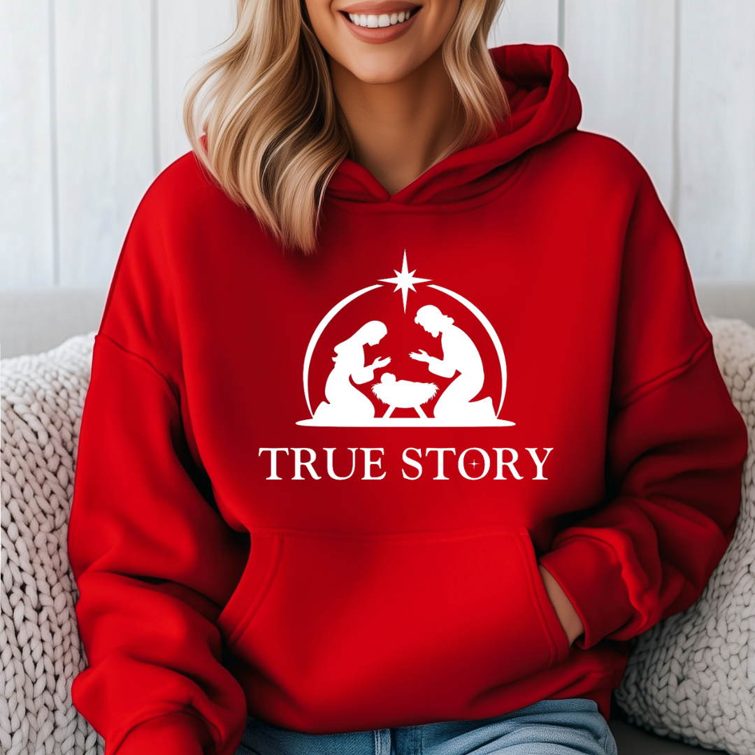 Red hooded sweatshirt that says, "True story" with an image of Baby Jesus, Mary & Joseph in a manger.