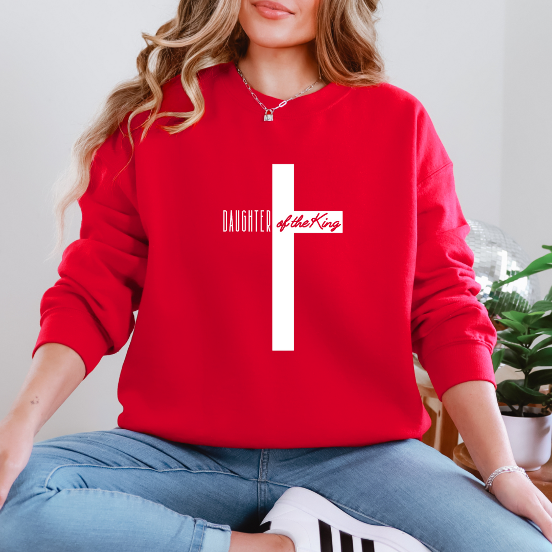 Red sweatshirt that says, "daughter of the King" across the middle of a large cross. 