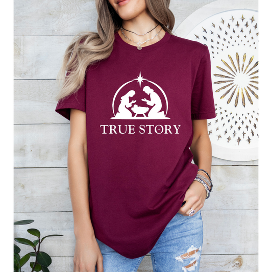 Maroon crewneck t-shirt that says, “true story” with Mary, Joseph and baby Jesus in a manger. Christian Christmas Holiday attire.