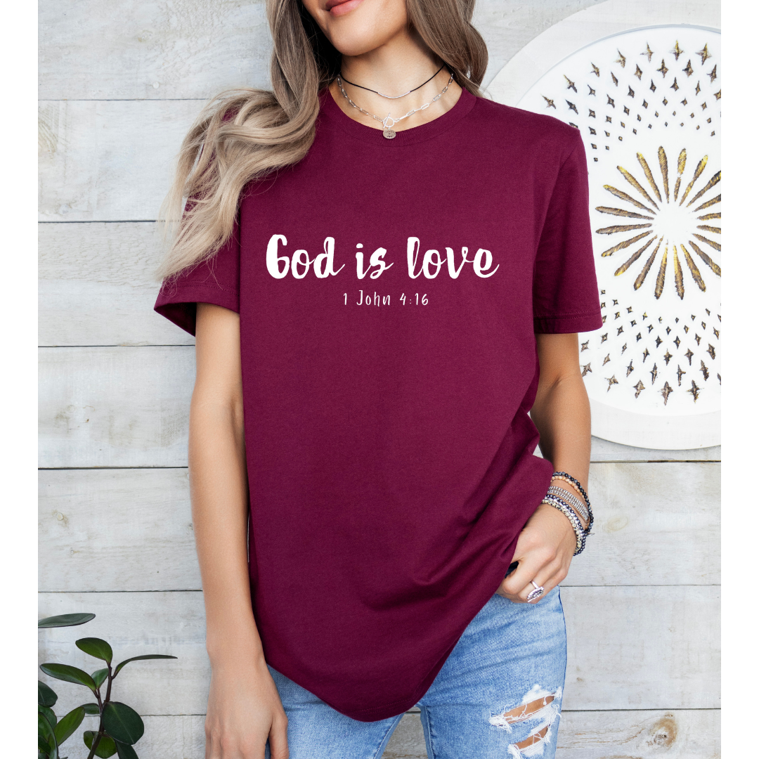 Maroon Crewneck t-shirt that says, “God is love. 1 John 4:16.” 